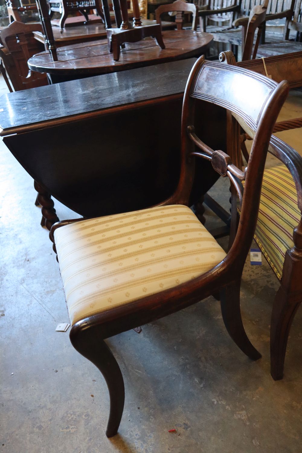 A Regency mahogany carver and a pair of dining chairs (3)